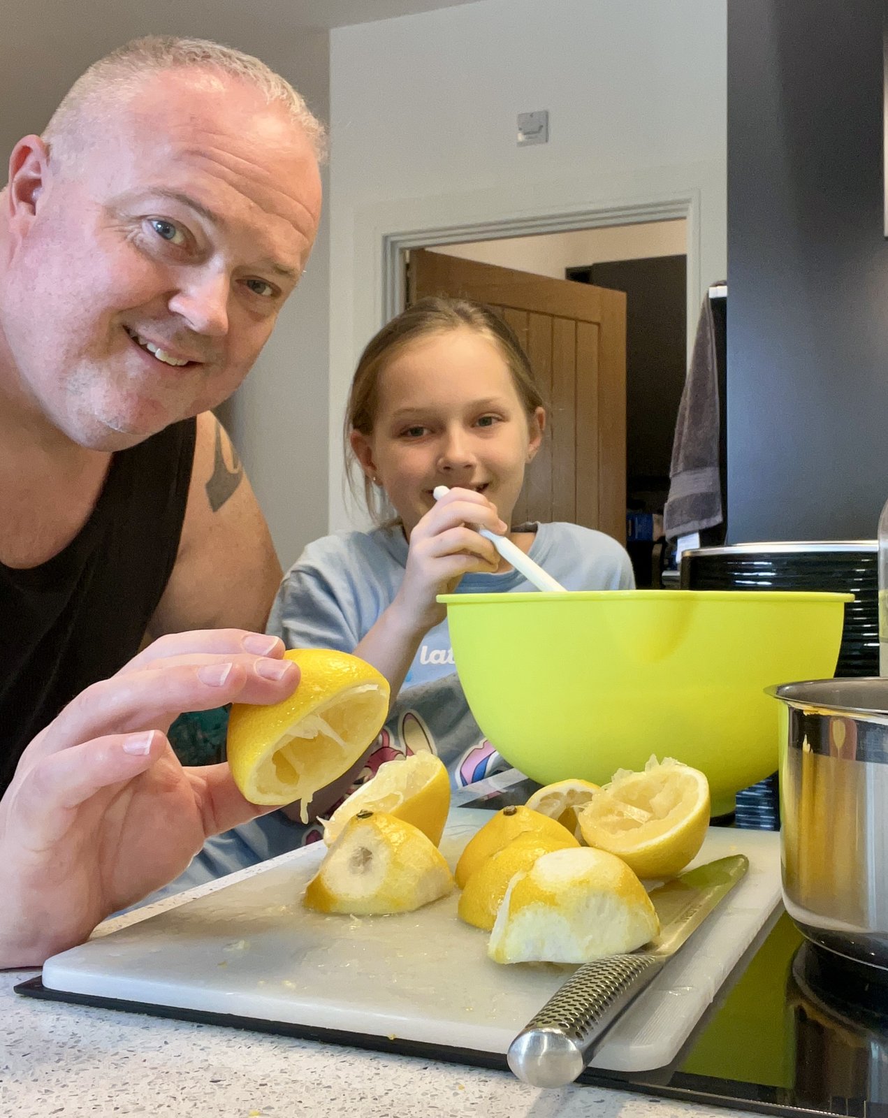 Leigh and his daughter Izzi making homemade lemonade in the kitchen